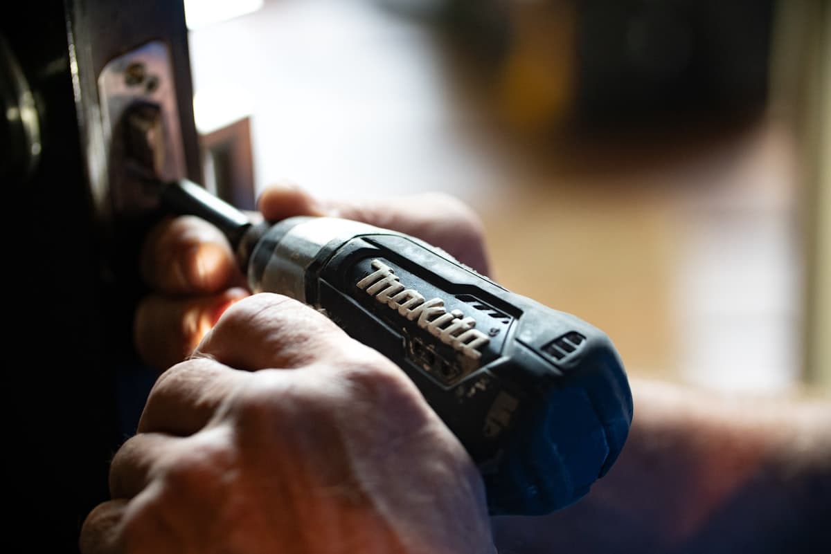 Fitting a door lock during a property maintenance visit